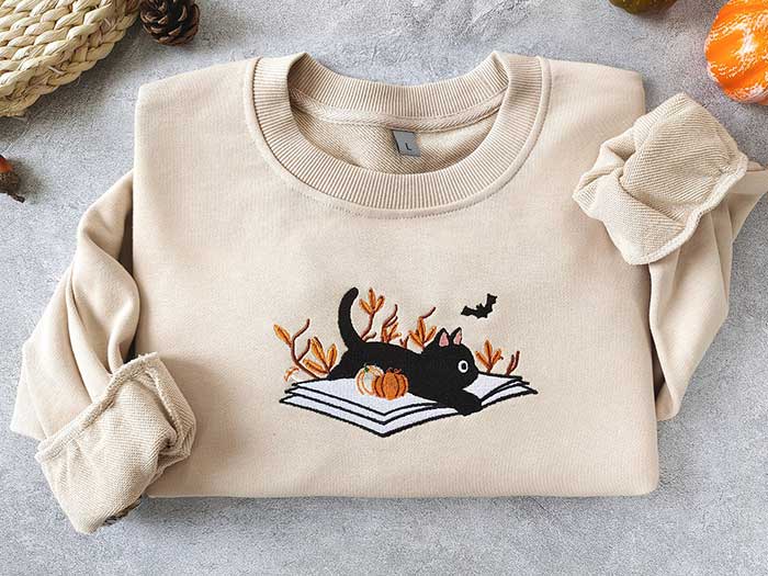 dream lake studio au sweatshirt via etsy fall sweatshirt with cat and books