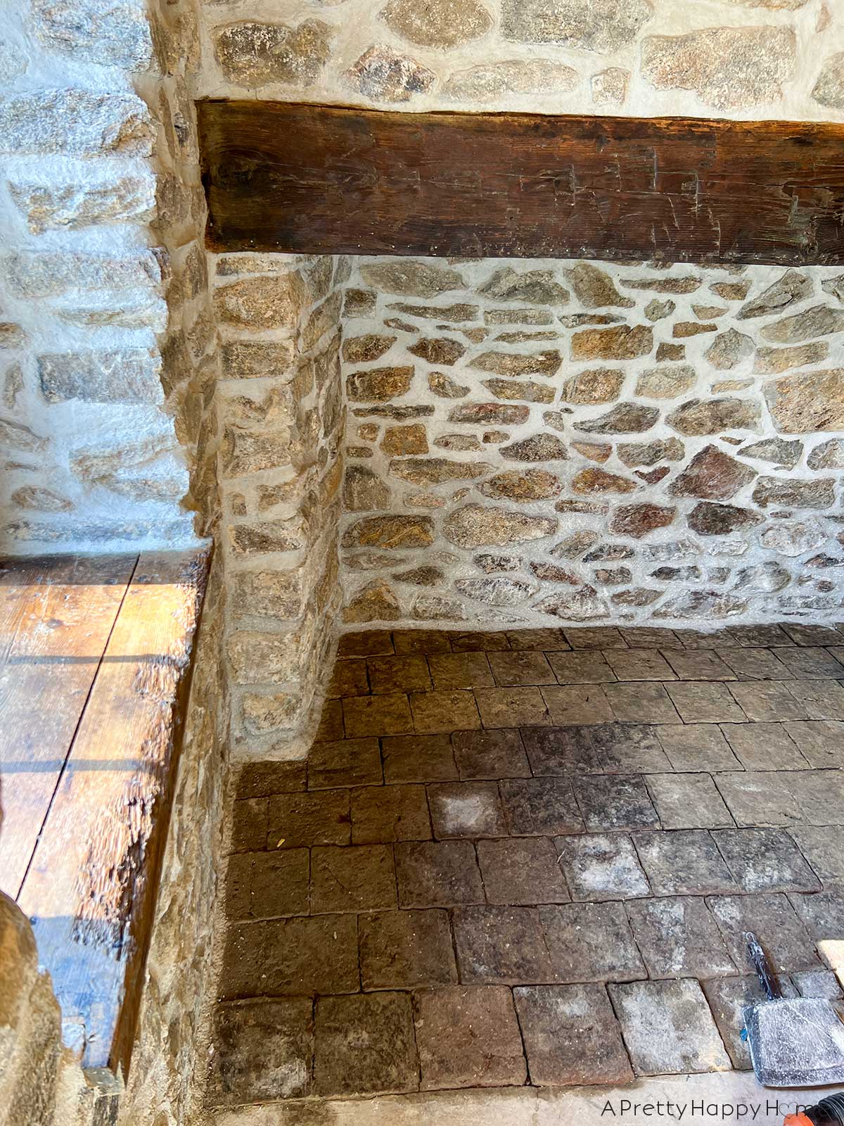 250 year old carriage house terracotta floor tiles hidden under dirt and revealed by scrubbing with water