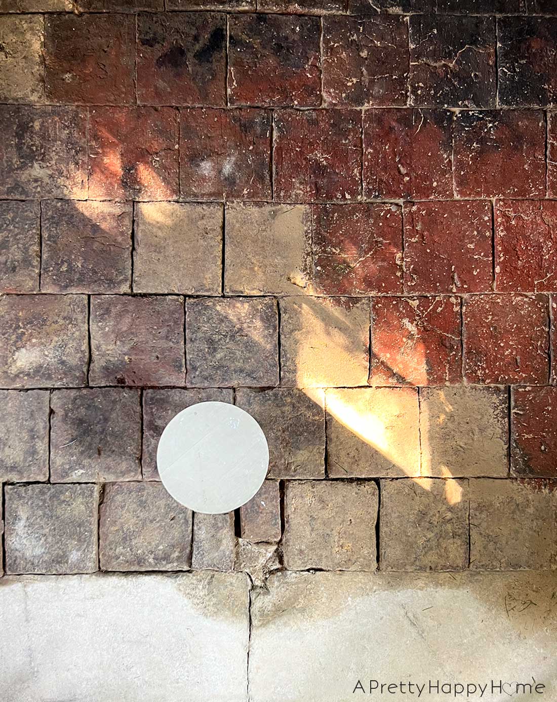 250 year old carriage house terracotta floor tiles hidden under dirt and revealed by scrubbing with water