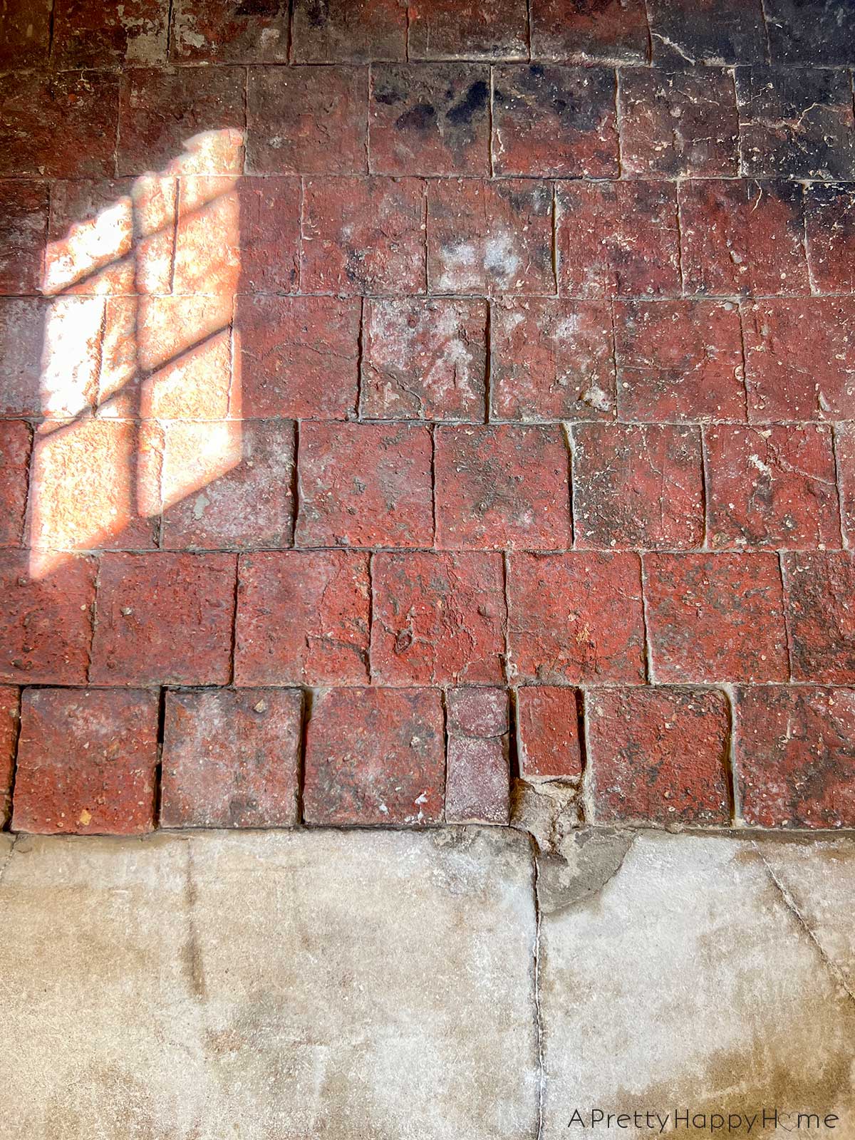 250 year old carriage house terracotta floor tiles hidden under dirt and revealed by scrubbing with water