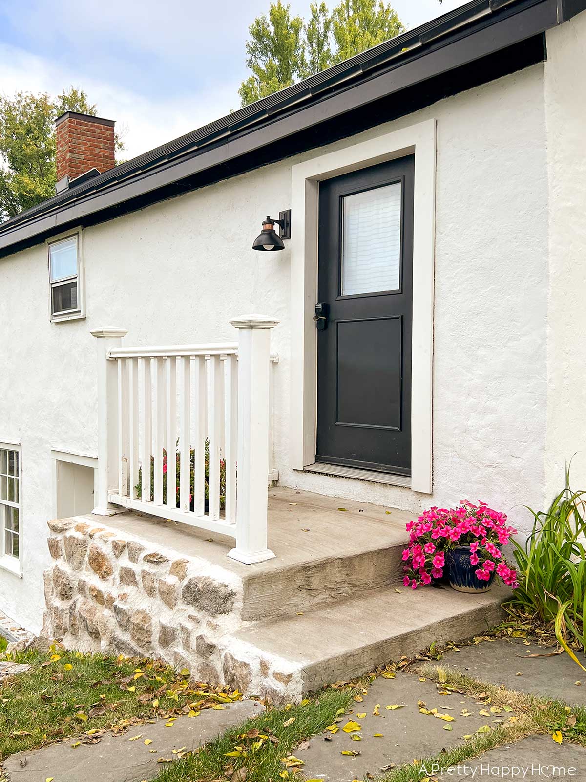 fieldstone porch made with fieldstone and lime mortar skimmed over concrete on a 250-year-old carriage house