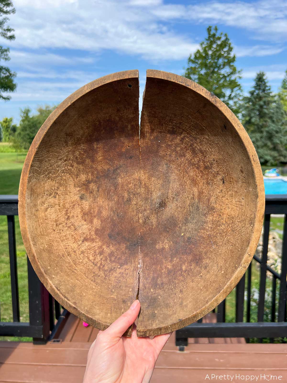 creative way to fix a cracked wood bowl with leather laces 