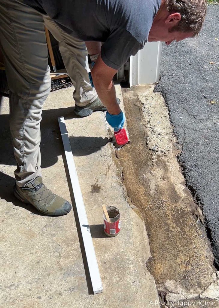 how to fix broken concrete by a garage door 