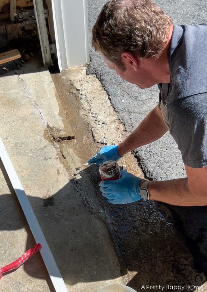 how to fix broken concrete by a garage door 