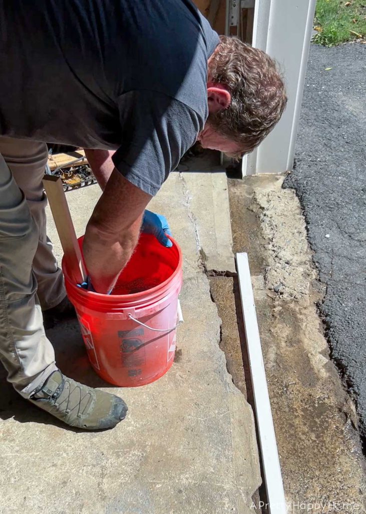 how to fix broken concrete by a garage door 