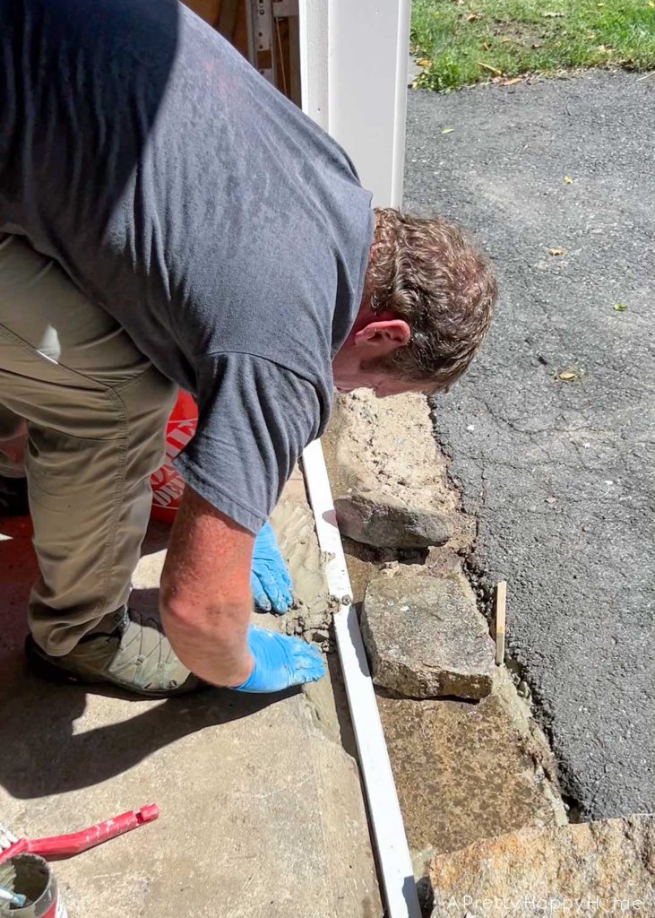 how to fix broken concrete by a garage door 