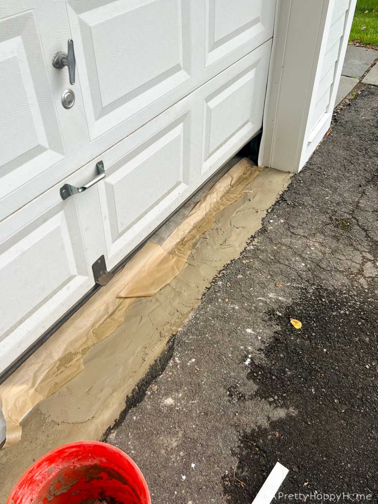 how to fix broken concrete by a garage door 