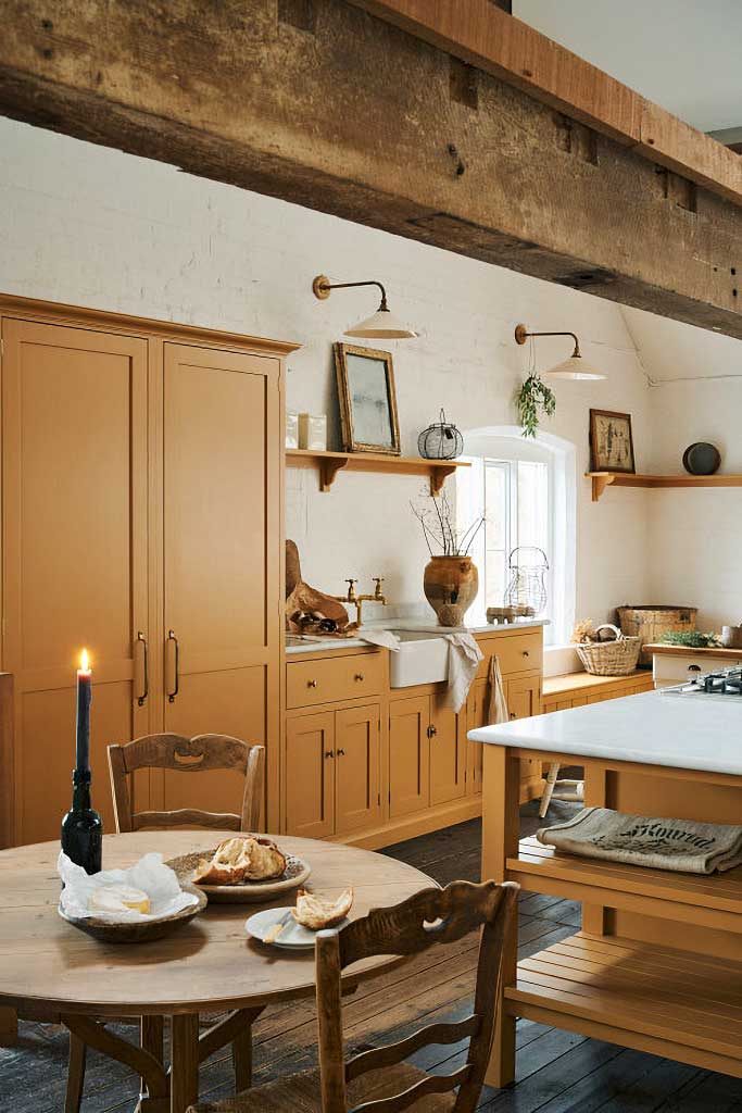 mustard yellow kitchen cabinets by devol via town and country living on the happy list