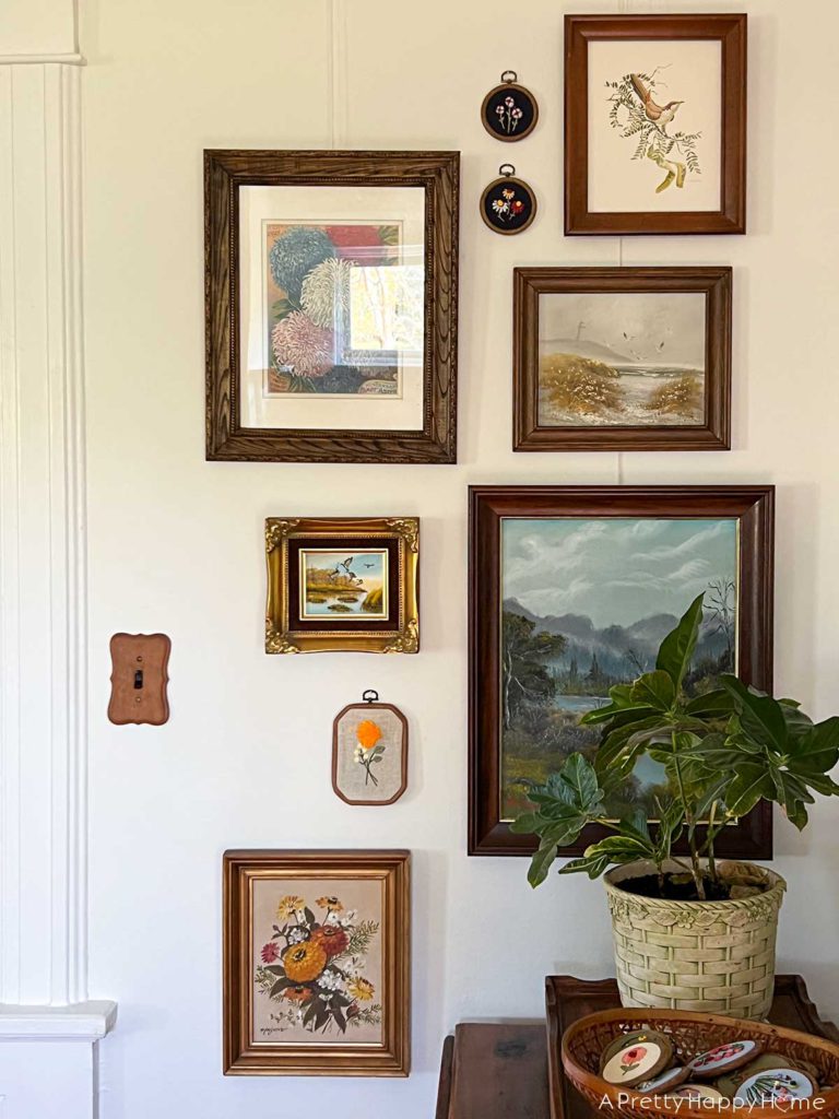 How I Styled My Latest Thrift Store Finds flower paintings on a gallery wall