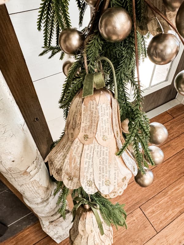 christmas bells with old book pages by the ponds farmhouse on the happy list