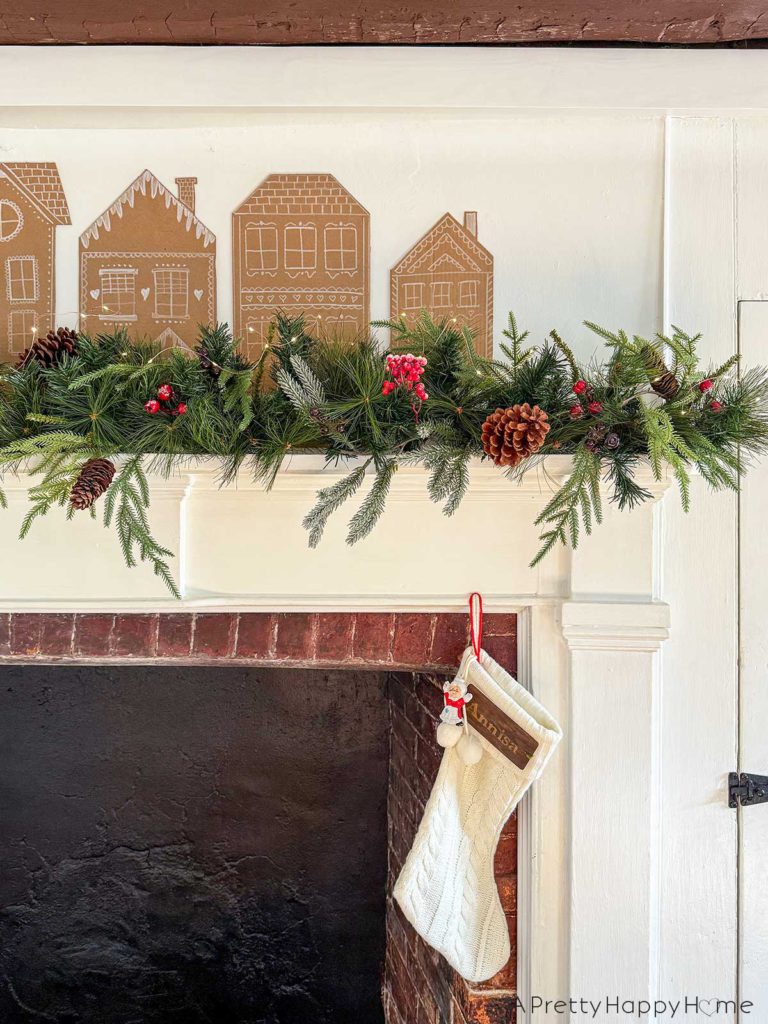 cardboard gingerbread house christmas mantel in a farmhouse