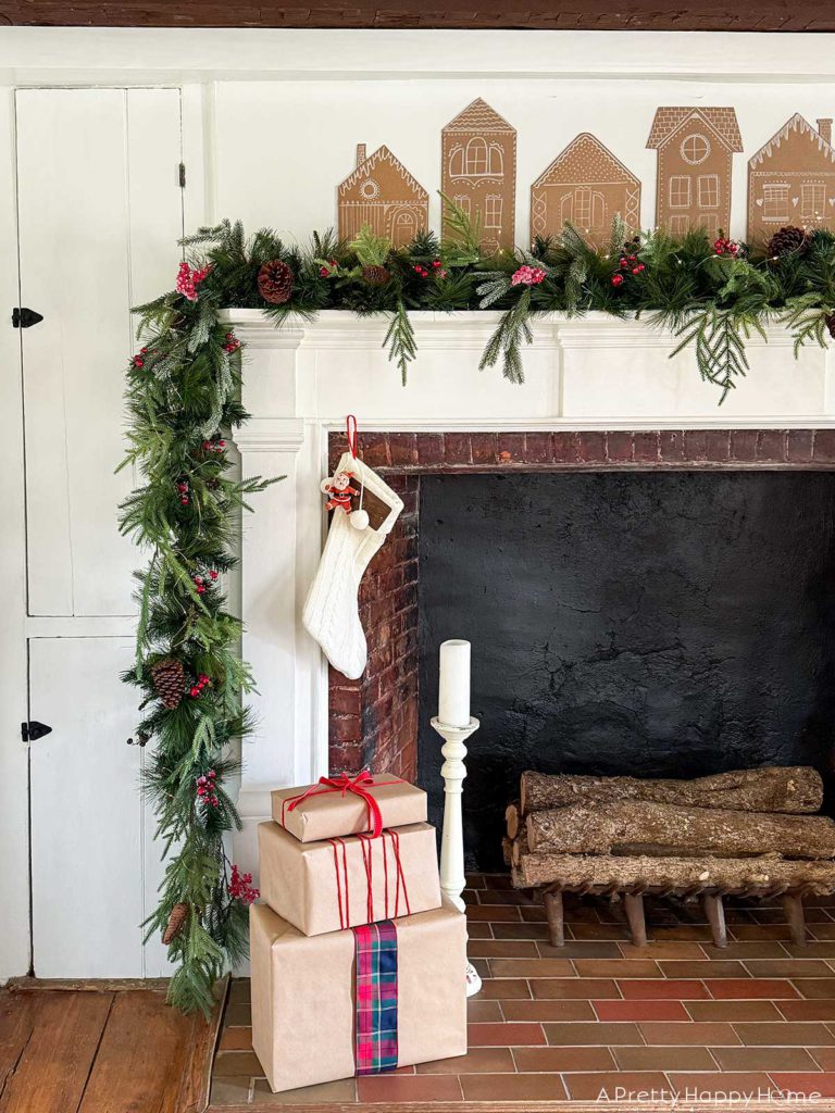 cardboard gingerbread house christmas mantel in a farmhouse