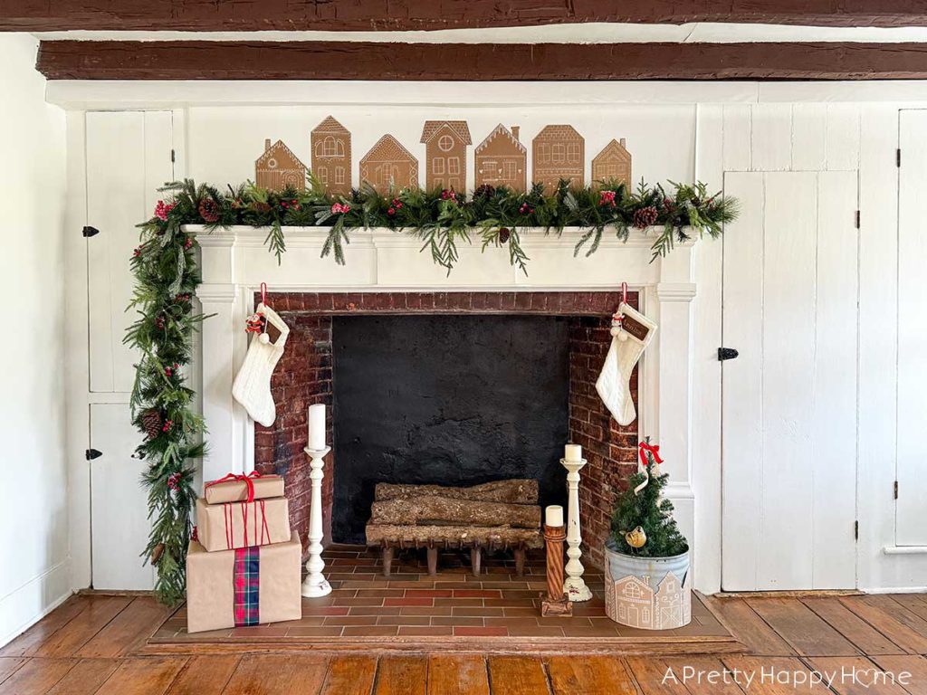 cardboard gingerbread house christmas mantel in a farmhouse