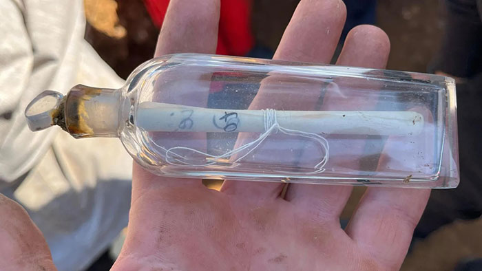 image guillaume blondel via BBC of message in a bottle discovered by french archaeologists on the happy list