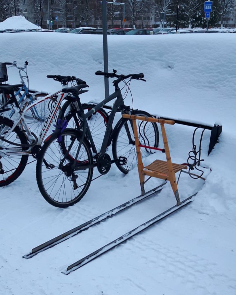 kicksled parked by bikes in finland via wikipedia on the happy list