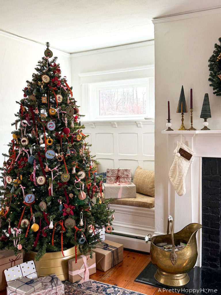 2024 Christmas Tree with embroidered flower ornaments macrame ornaments and ribbon in an old colonial farmhouse