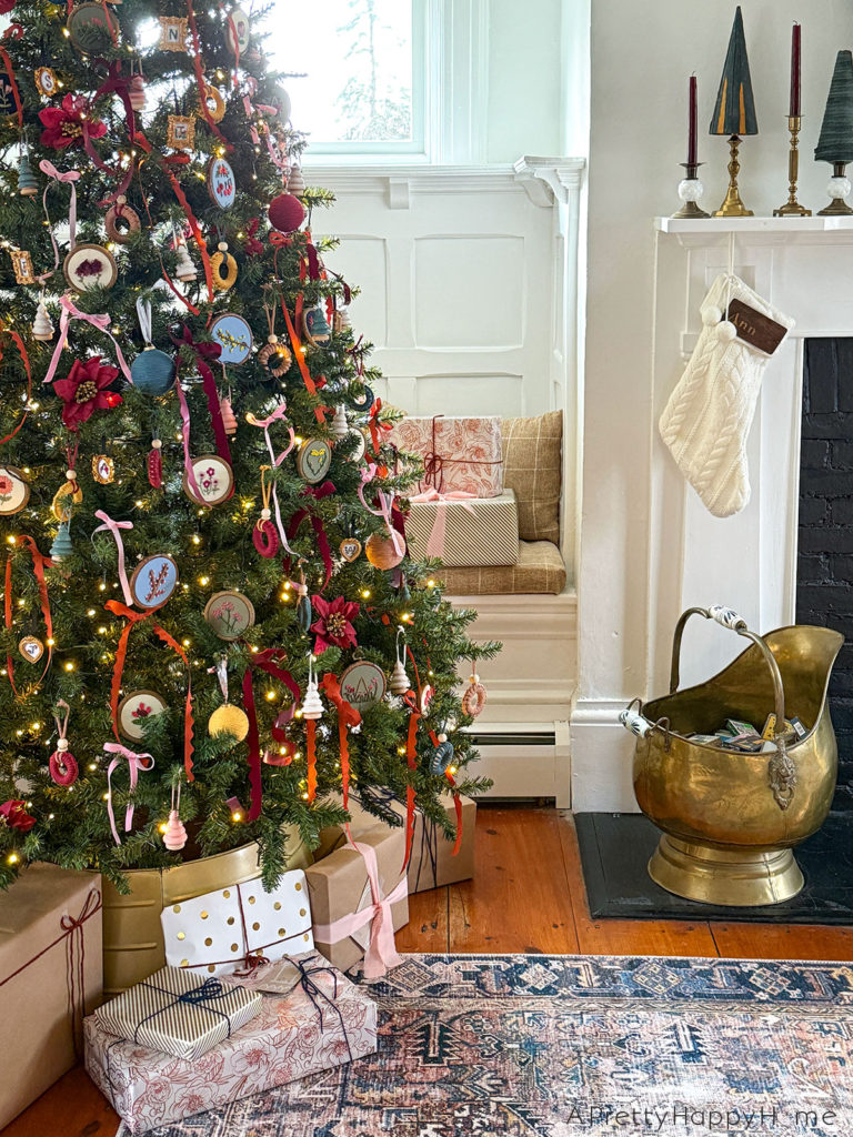 2024 Christmas Tree with embroidered flower ornaments macrame ornaments and ribbon in an old colonial farmhouse