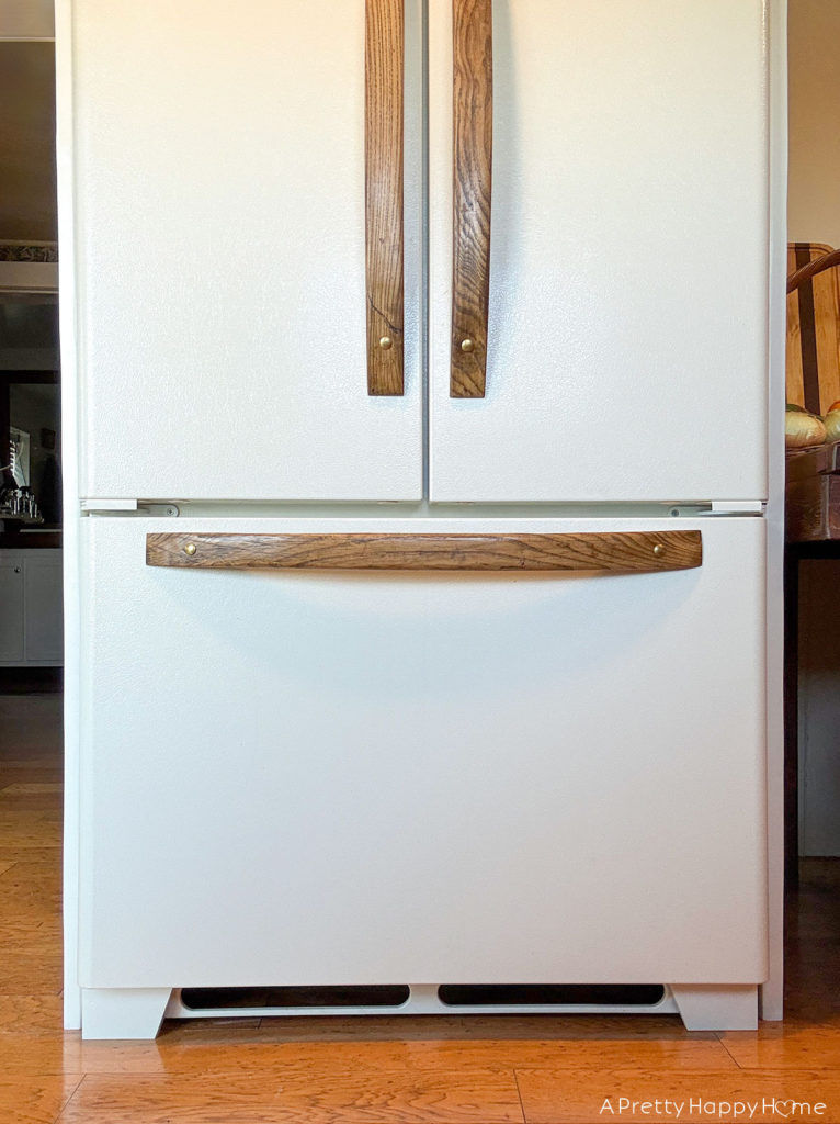 Building In Our Fridge: Four Ways To Customize A Fridge shaker style cabinet around fridge using tongue and groove construction. remove plastic grate at bottom of fridge and add feet to bottom of fridge