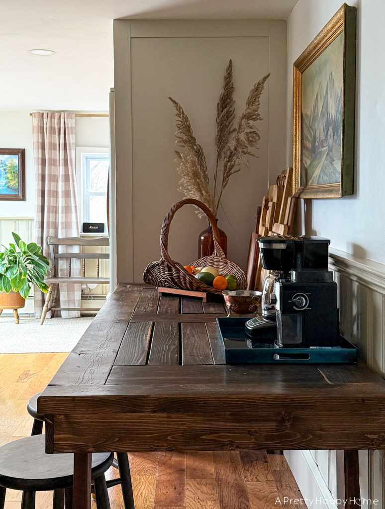 partially unfitted farmhouse kitchen with a wood table for a work surface