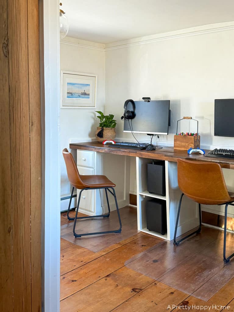 DIY Copper Toe Kick For Built-In Desks to solve the problem of feet scuffing the trim using adhesive copper toe kick cut with metal snips farmhouse style desks