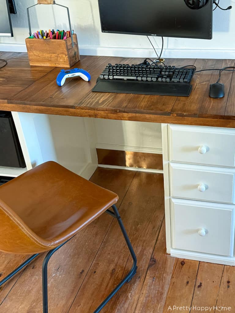 DIY Copper Toe Kick For Built-In Desks to solve the problem of feet scuffing the trim using adhesive copper toe kick cut with metal snips farmhouse style desks