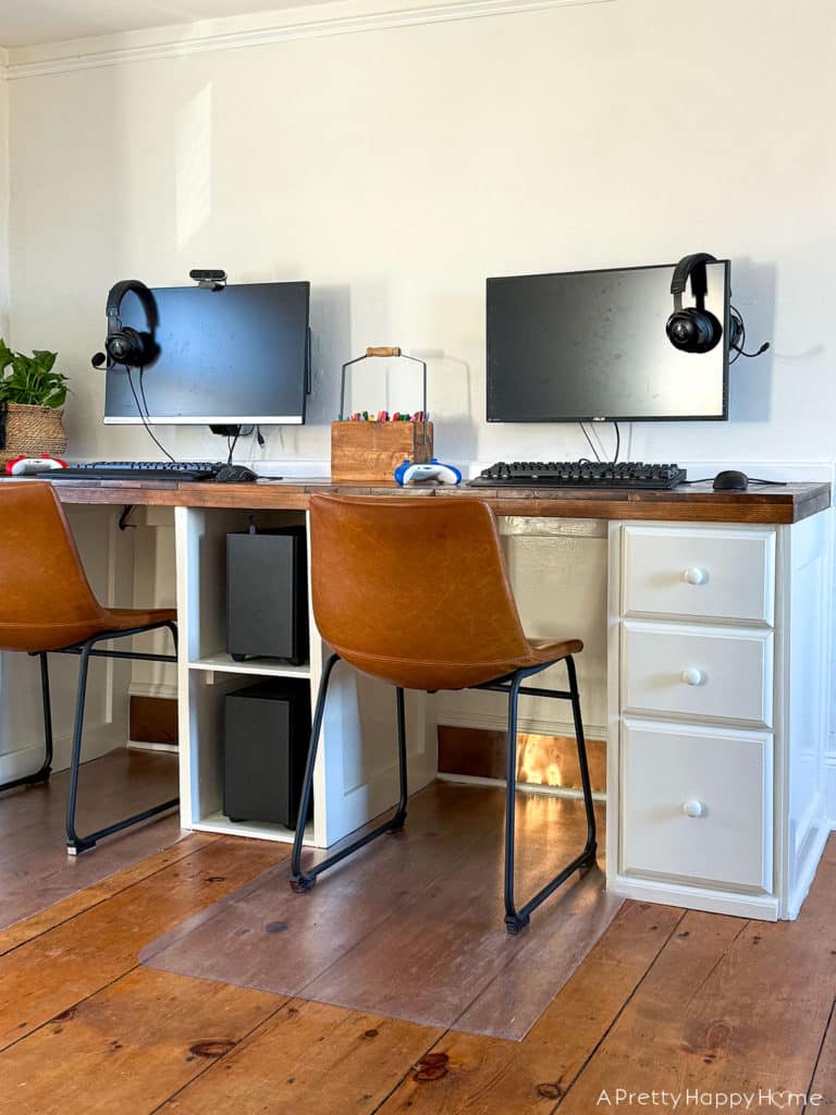 DIY Copper Toe Kick For Built-In Desks to solve the problem of feet scuffing the trim using adhesive copper toe kick cut with metal snips farmhouse style desks