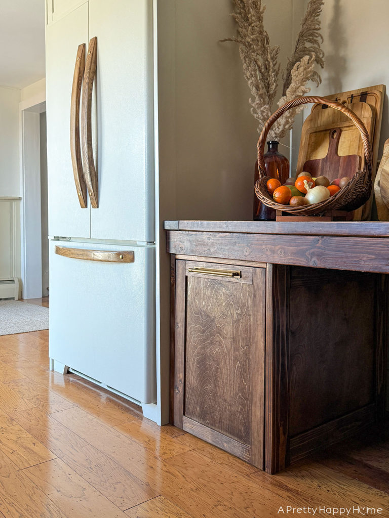 farmhouse kitchen with wood refrigerator handles in praise of wood knobs and pulls