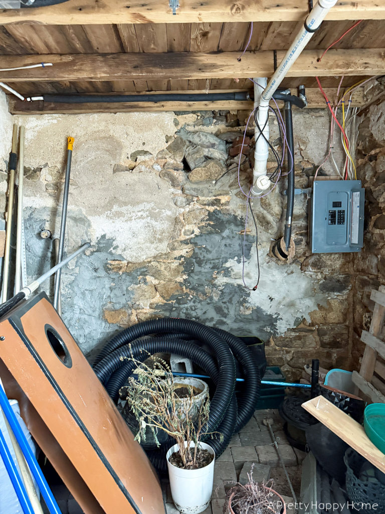 BEFORE stone carriage house gym expansion home gym with stone walls and wood ceiling