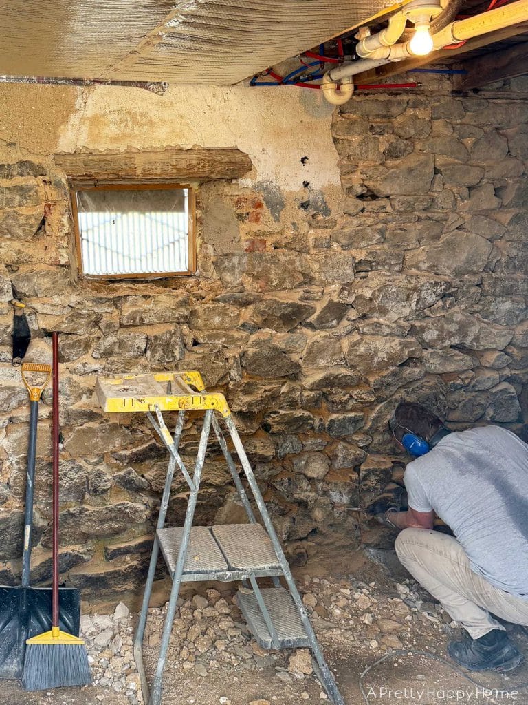 Stone Carriage House Gym Old Windows field stone foundation with old abandoned window preparing for lime repointing