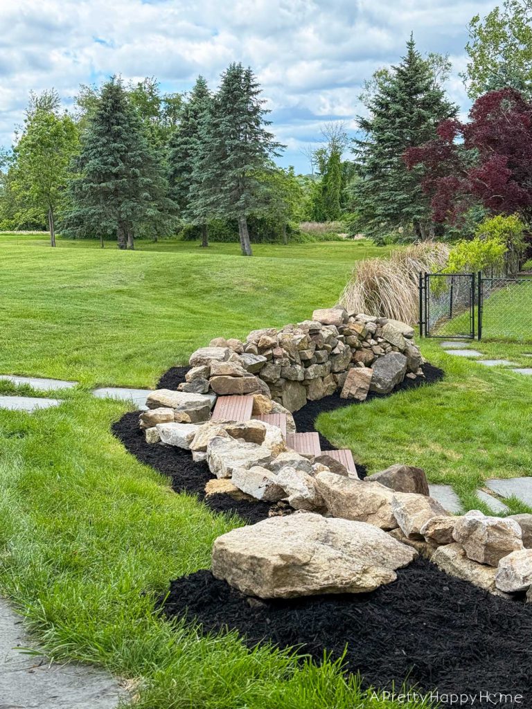 dry stacked sone walls surrounded by flagstone paths