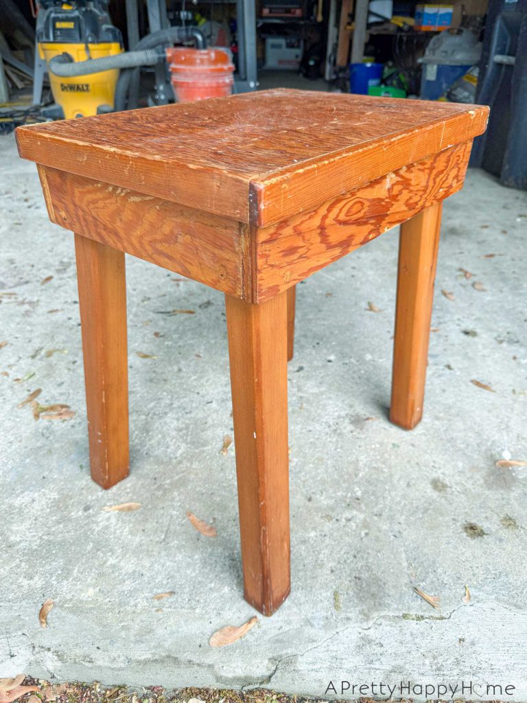 BEFORE farmhouse style plywood side table stained with paint dipped legs in black