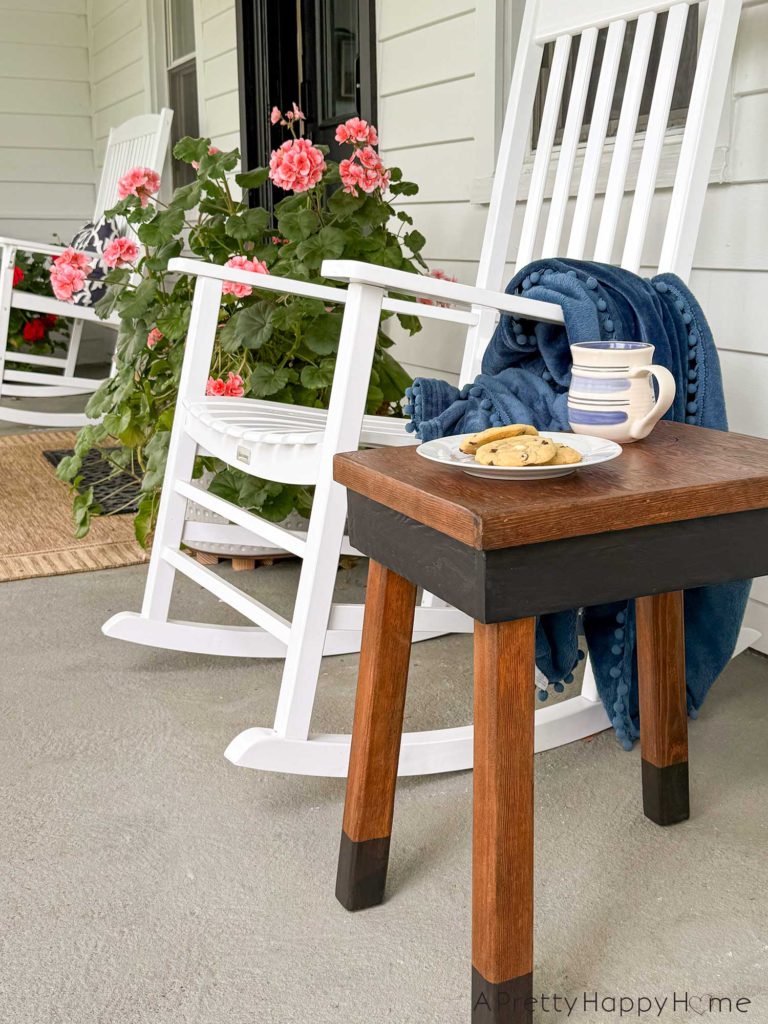 farmhouse style plywood side table stained with paint dipped legs in black