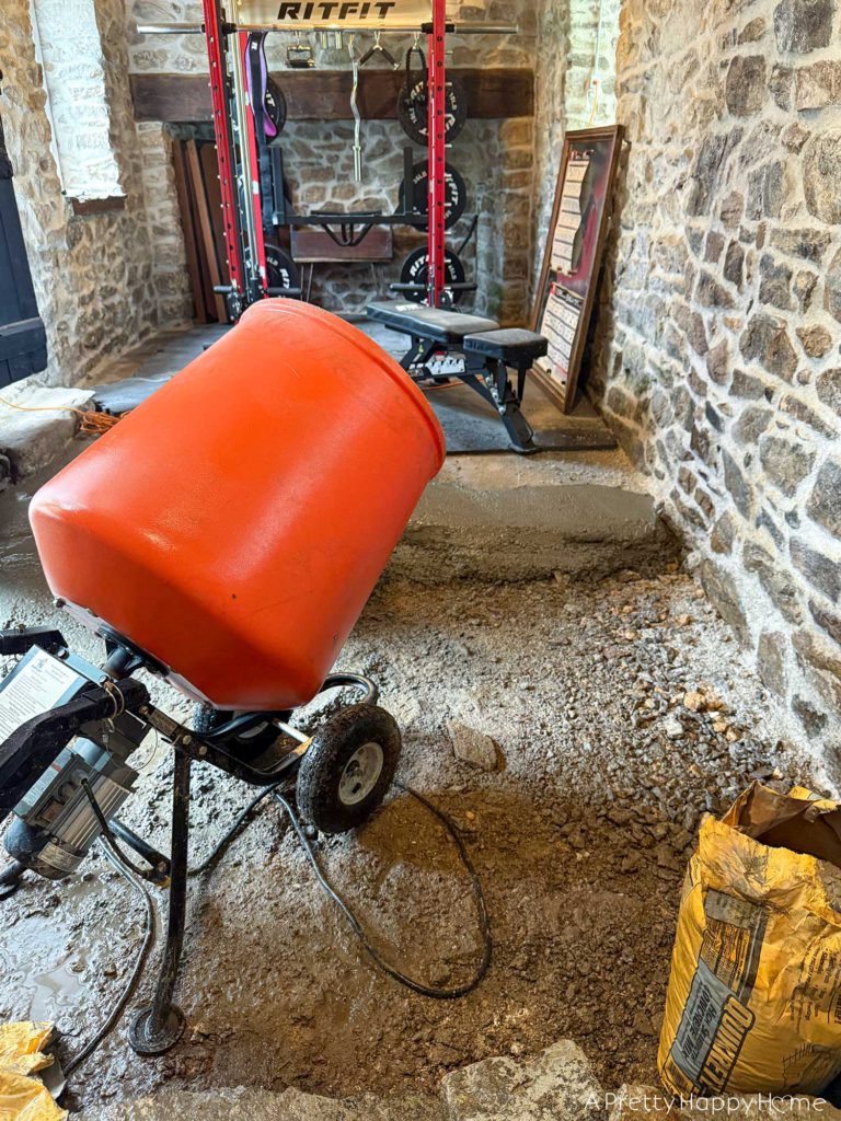 stone carriage house gym expansion removing a stone wall in an old building and repairing the floor underneath with concrete