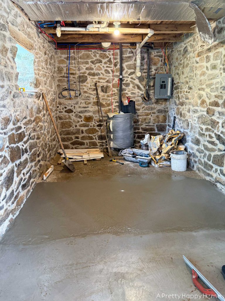 stone carriage house gym expansion removing a stone wall in an old building and repairing the floor underneath with concrete