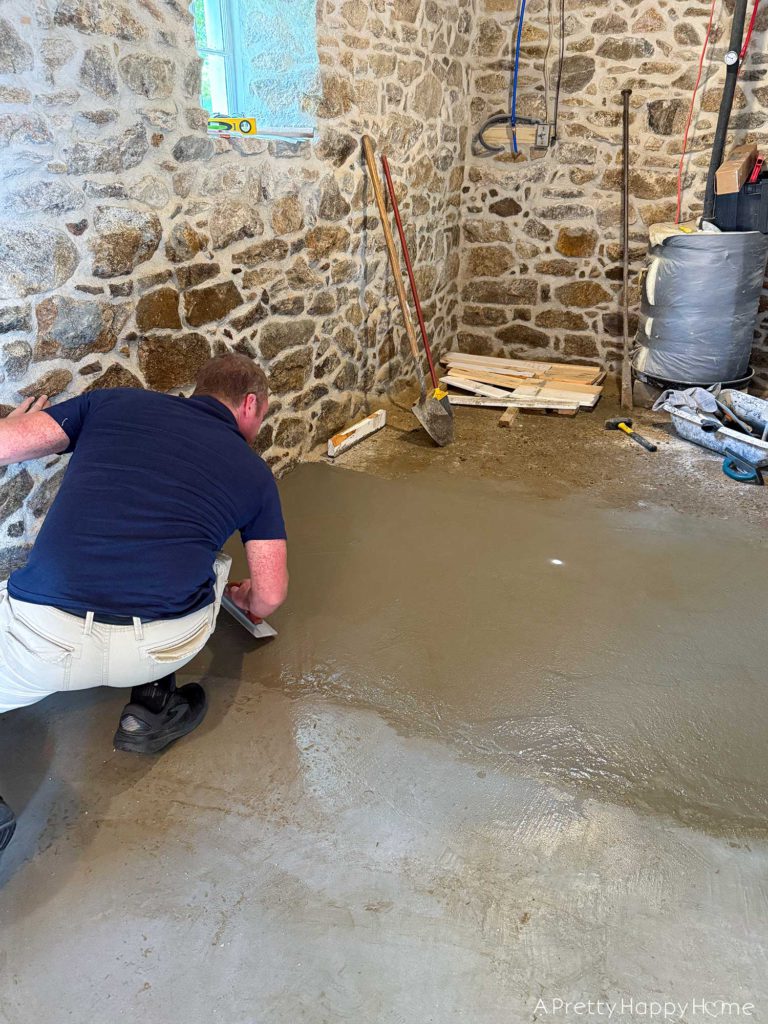 stone carriage house gym expansion removing a stone wall in an old building and repairing the floor underneath with concrete