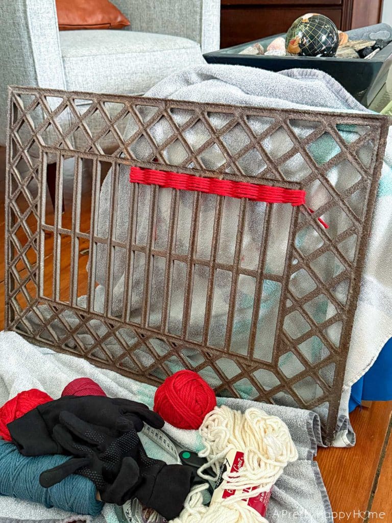 Woven American Flag on an Antique Grate in a colonial era farmhouse flag is woven with red white and blue yarn in process photo