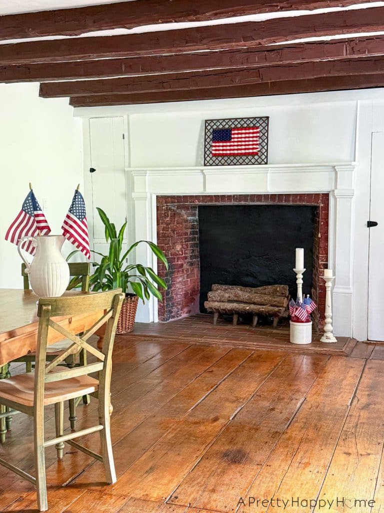 Woven American Flag on an Antique Grate in a colonial era farmhouse flag is woven with red white and blue yarn
