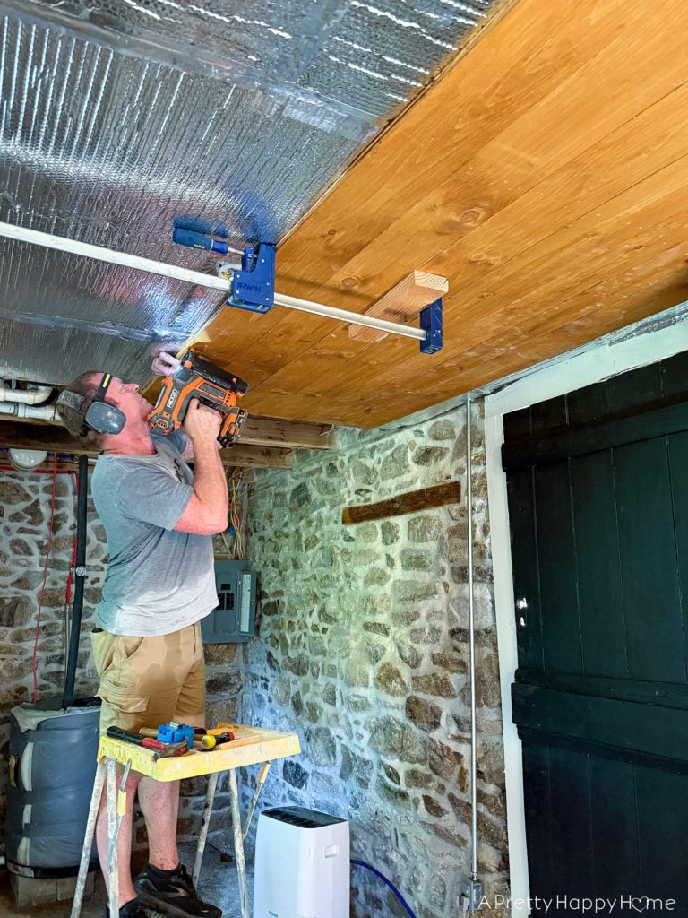 Stone Carriage House Gym: Part 9, The Ceiling rustic tongue and groove planked ceiling in a stone building