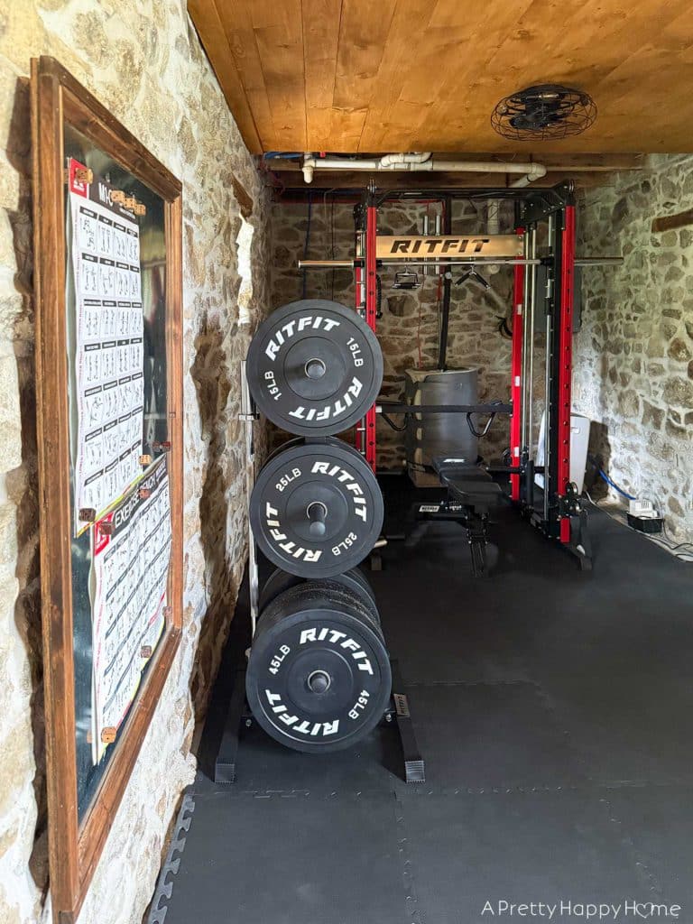stone carriage house gym expansion home gym with stone walls and wood ceiling