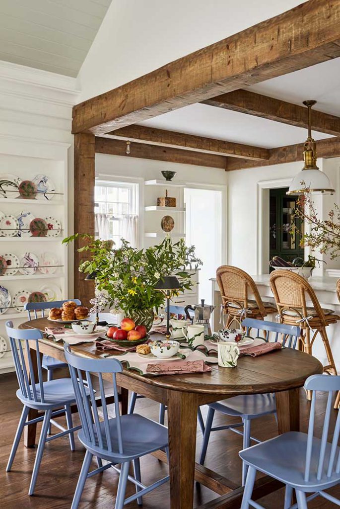jennifer hunter dining room table with blue chairs PHOTO BY RIKKI SNYDER; STYLING BY FRANCIS BAILEY for house beautiful on the happy list