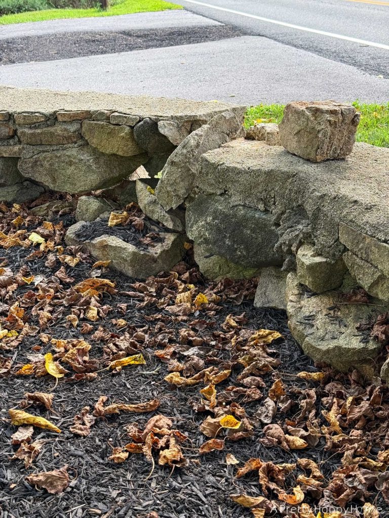 BEFORE DIY low curved fieldstone wall the plan to fix it ourselves with lime mortar