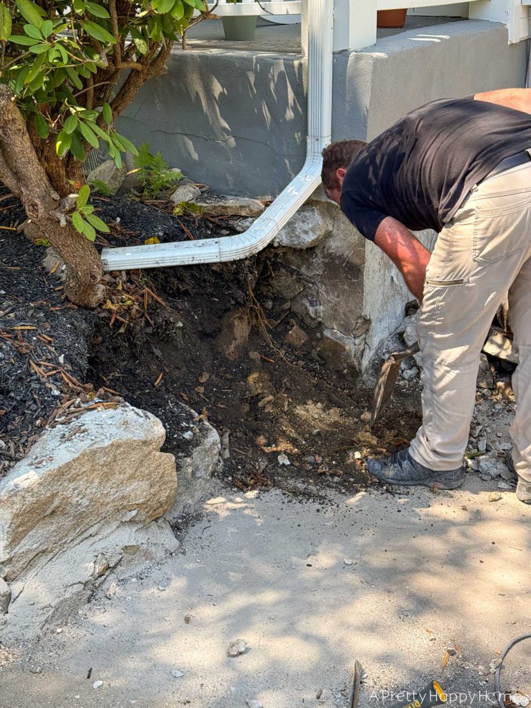 diy curved fieldstone wall demoing the old wall on a colonial era farmhouse