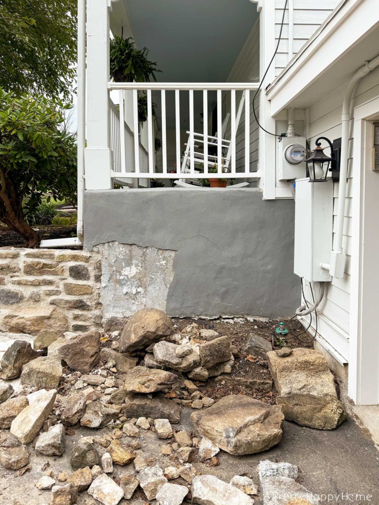 Curved Fieldstone Wall: Part 5, Porch Wall removing concrete skim coat on a stone foundation wall and repointing with lime mortar