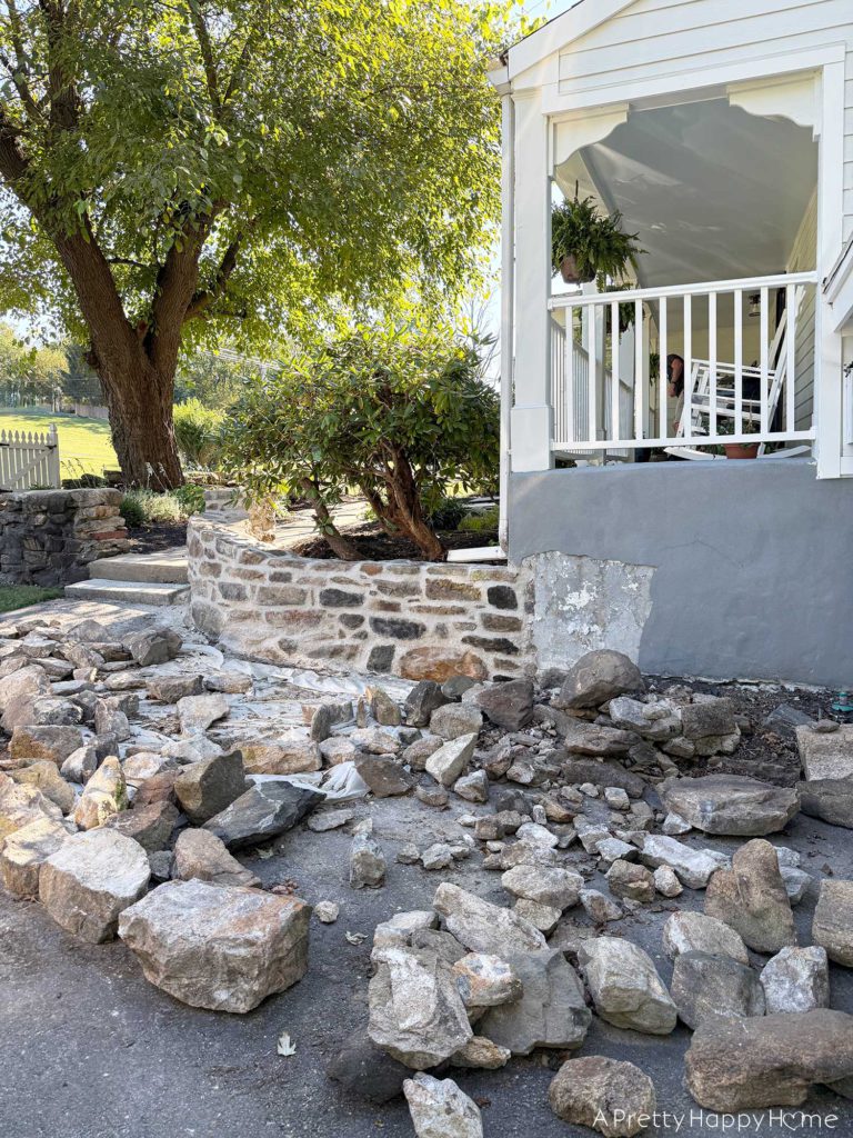 newly rebuilt curved fieldstone wall using lime mortar and natural fieldstone