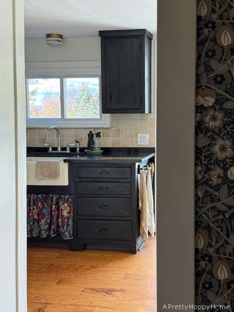 mini kitchen makeover five years later how it held up farmhouse kitchen with stained black cabinets