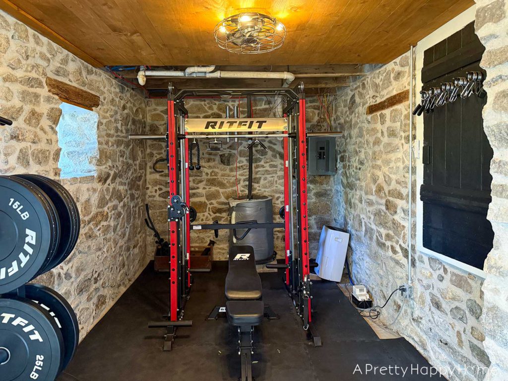 converting a door to a window in a stone building with a stone foundation home gym in a fieldstone building