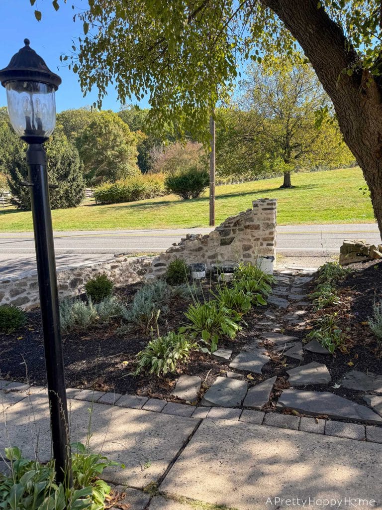 historic masonry DIY curved fieldstone wall adding a swoop and a column built with all natural fieldstone and lime mortar