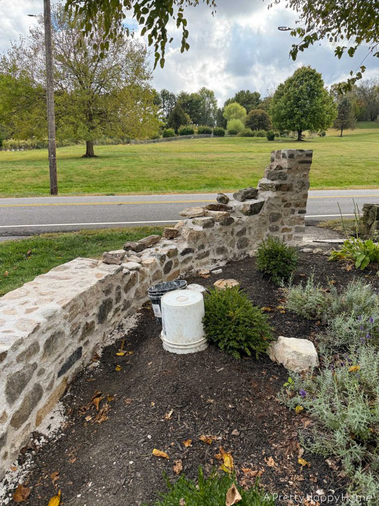 historic masonry DIY curved fieldstone wall adding a swoop and a column built with all natural fieldstone and lime mortar