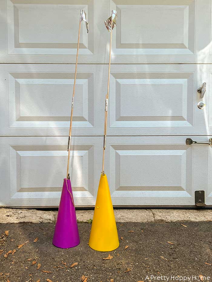 yellow and purple safety cones shown with homemade flags to help assist with learning how to parallel parking on the happy list