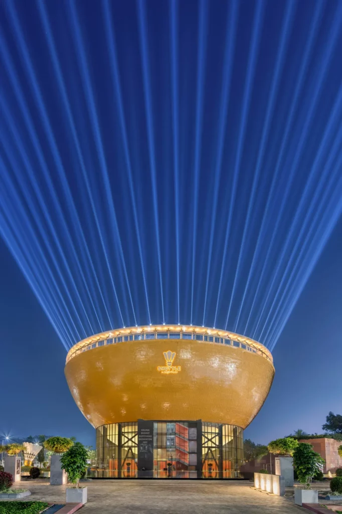 the shuttle badminton centre in india that is designed to look like a shuttlecock at night